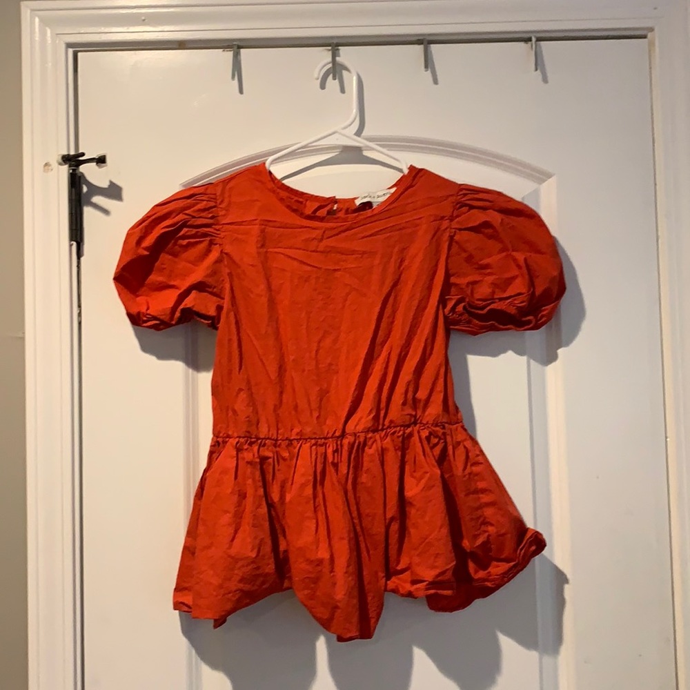 Red top with puffy sleeves
